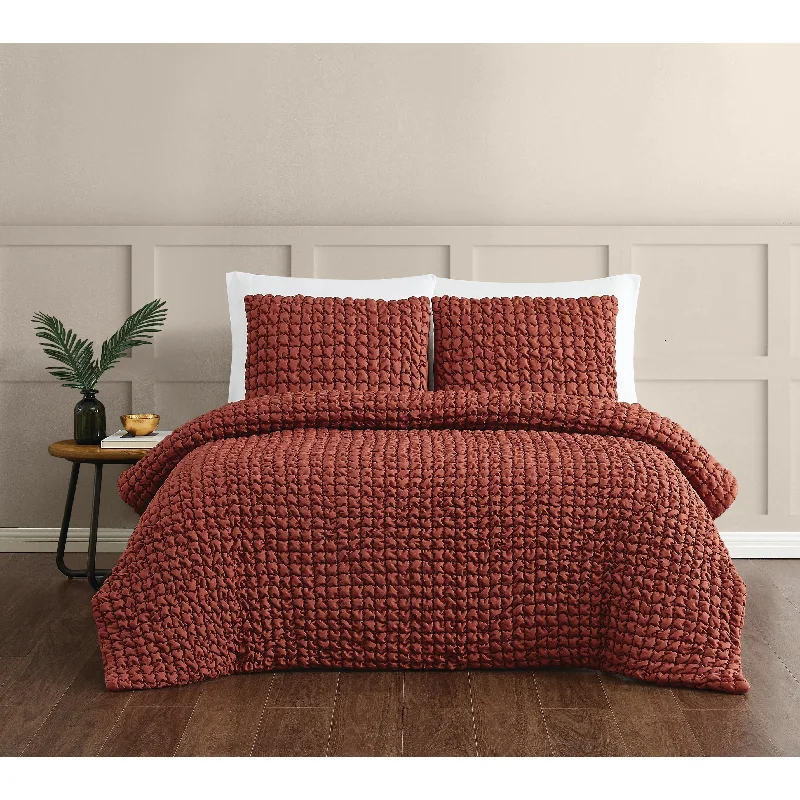 Synthetic - filled comforters like polyester for affordability and hypoallergenic propertiesChristian Siriano NY® Textured Puff Comforter Set